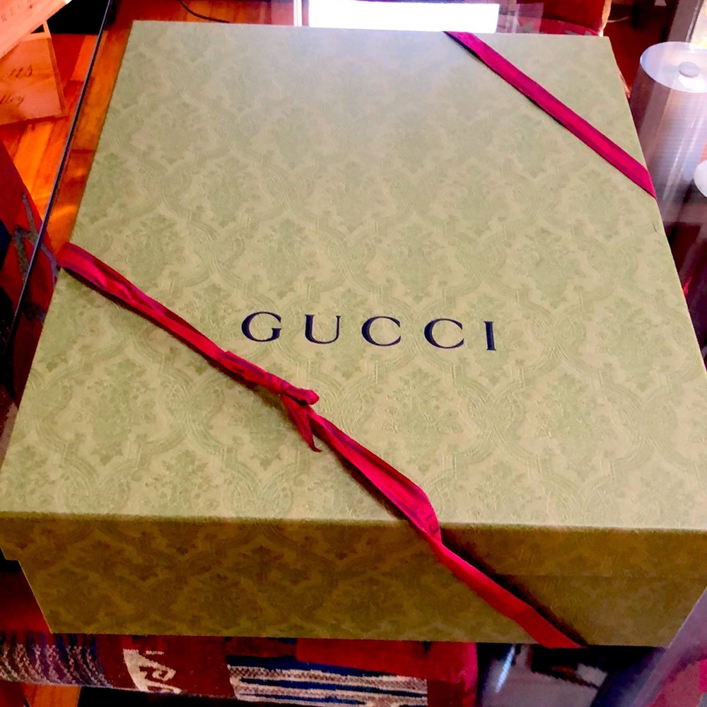 Gucci box with Gucci ribbon & Gucci tissue paper.